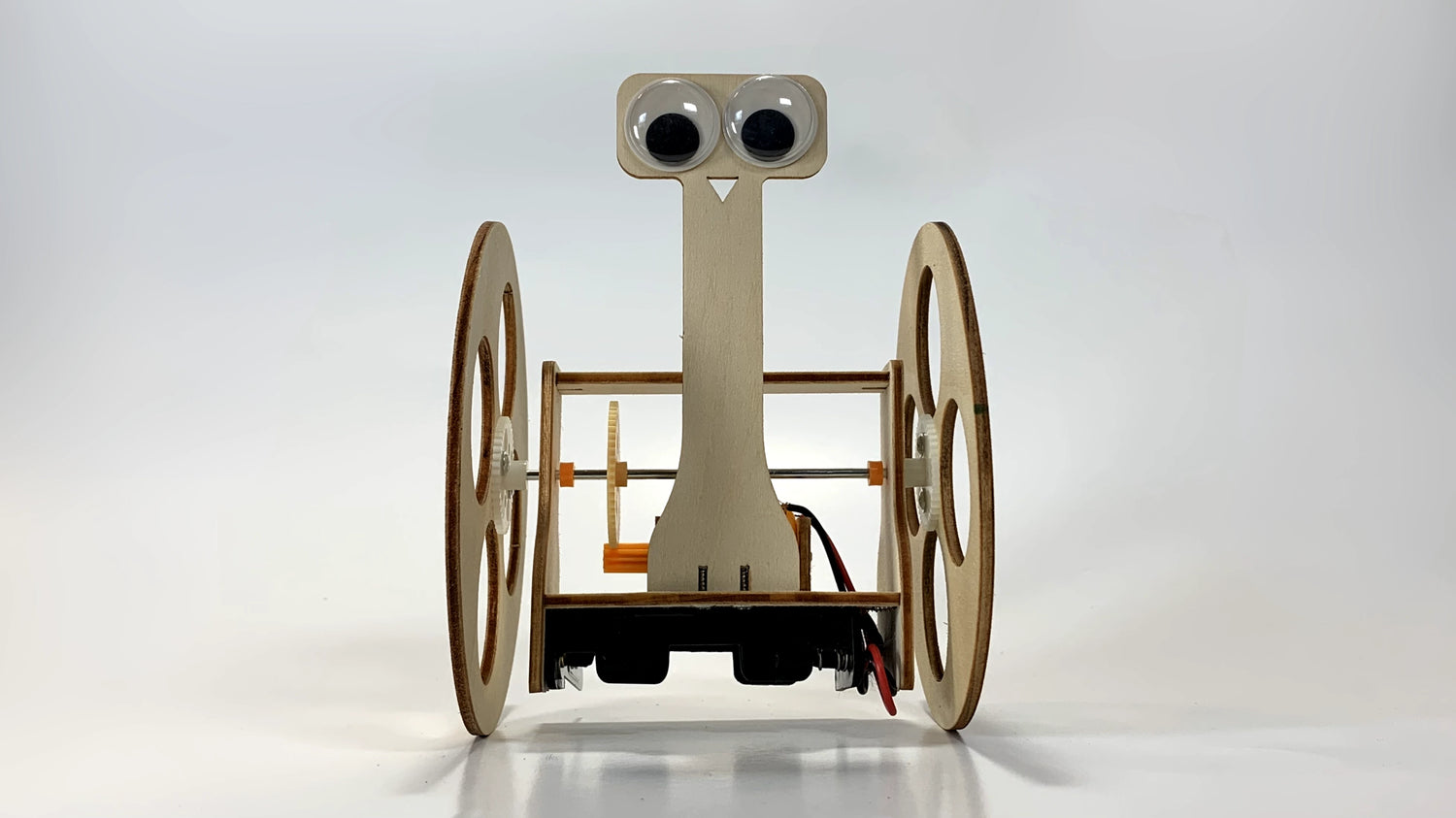 Front-Facing View of Balance Robot Buddy STEM Kit – Wooden DIY Robot with Gears, Wheels, and Googly Eyes for STEM Learning