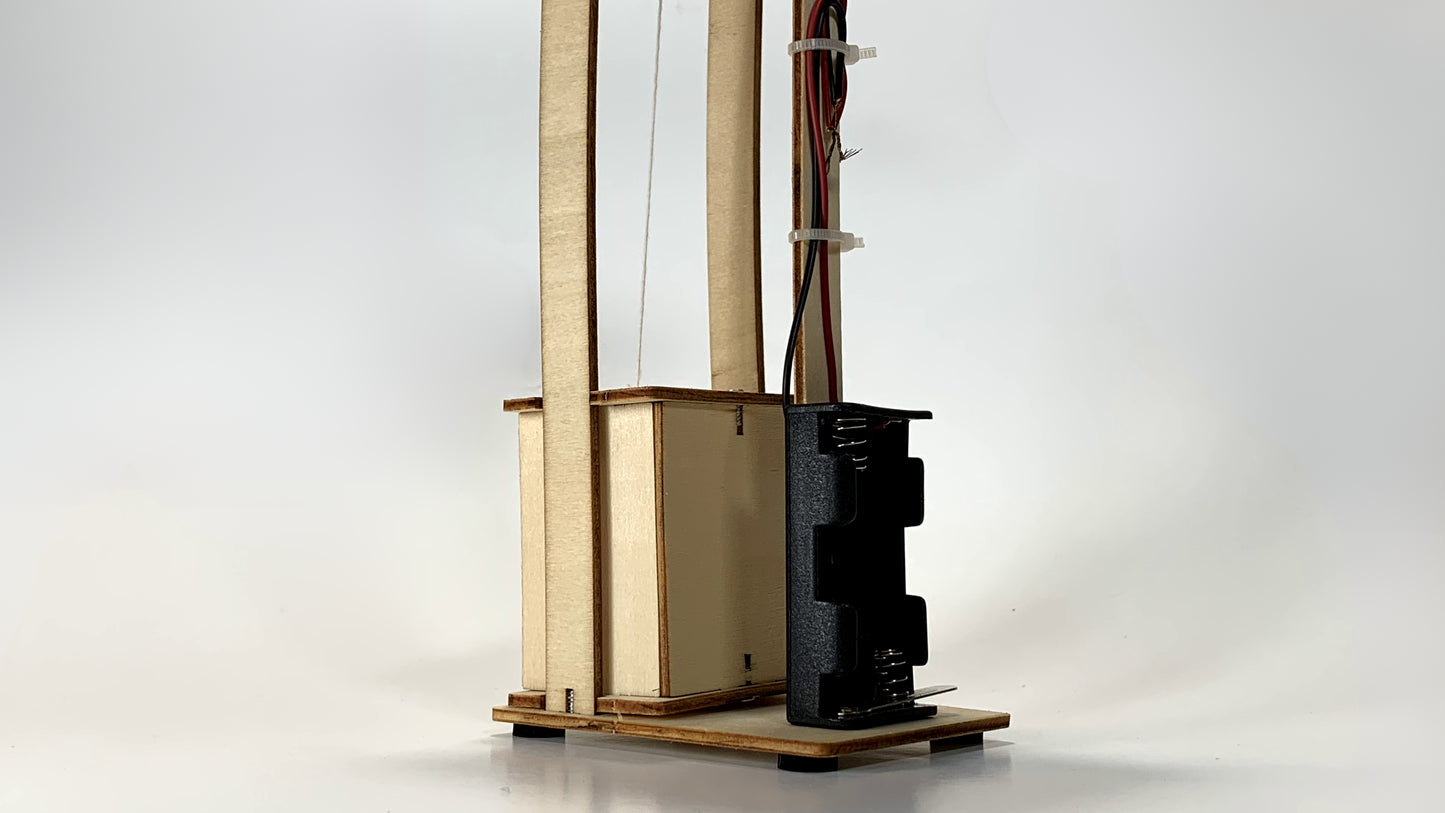 Side View of Electric Elevator STEM Kit – Wooden DIY Model with Battery Pack and Wiring for STEM Learning Projects