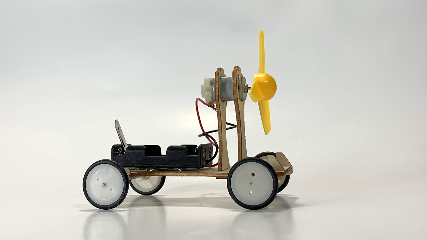 Opposite Side View of Electric Wind Car STEM Kit – Wooden DIY Model with Yellow Propeller, Motor, and Battery Pack for STEM Education