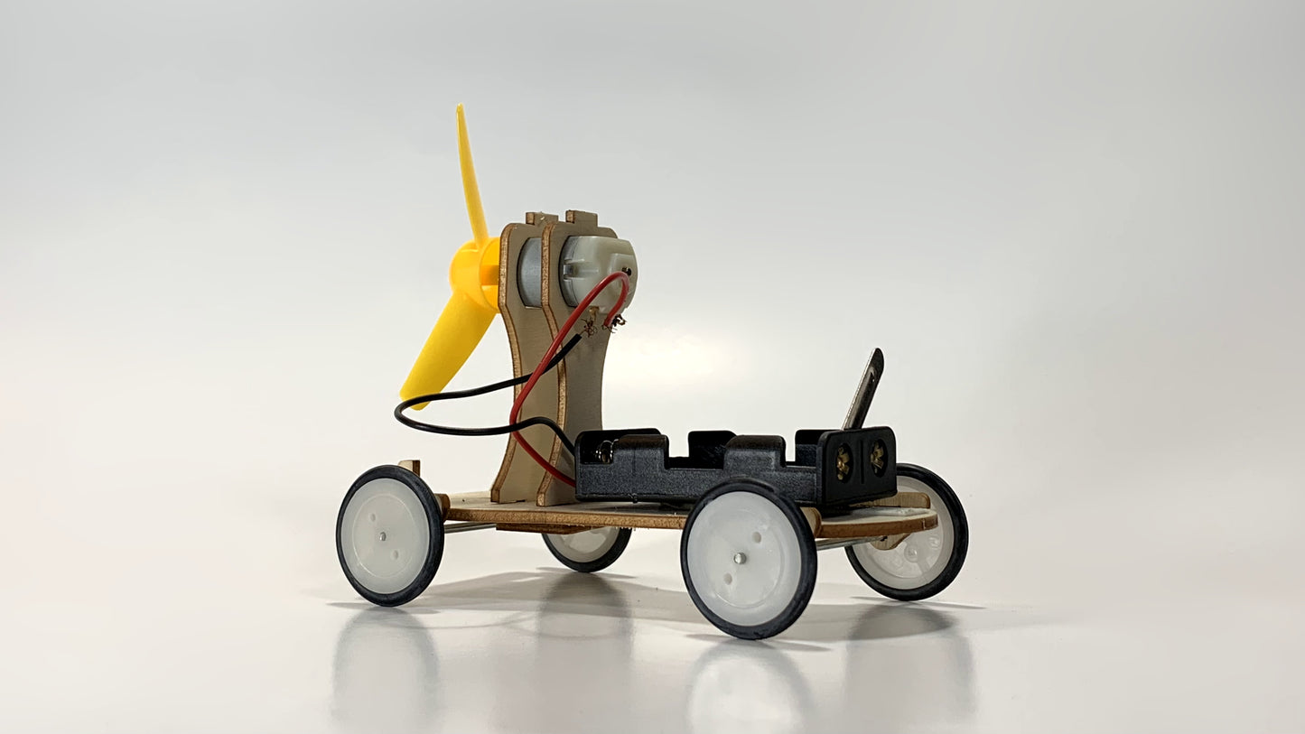 Rear Side View of Electric Wind Car STEM Kit – Wooden DIY Model with Yellow Propeller, Motor, and Battery Pack for STEM Learning