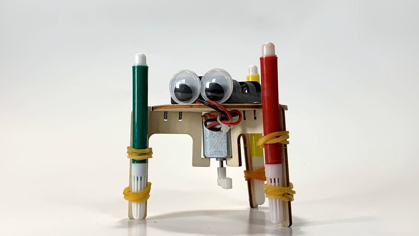 Close-Up Front View of Graffiti Robot STEM Kit – Motorized Drawing Robot with Googly Eyes, Green and Red Marker Legs