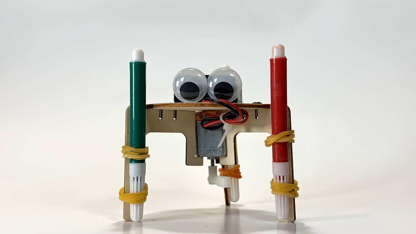 Front View of Graffiti Robot STEM Kit – Motorized Drawing Robot with Green and Red Marker Legs and Googly Eyes