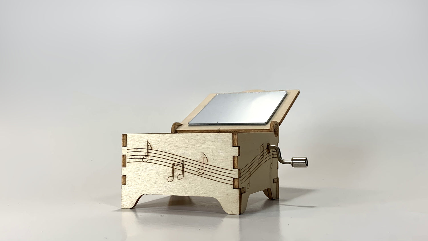 Hand Crank Music Box STEM Kit – Angled Side View Showing Wooden Music Box with Mirror on Lid and Crank Handle