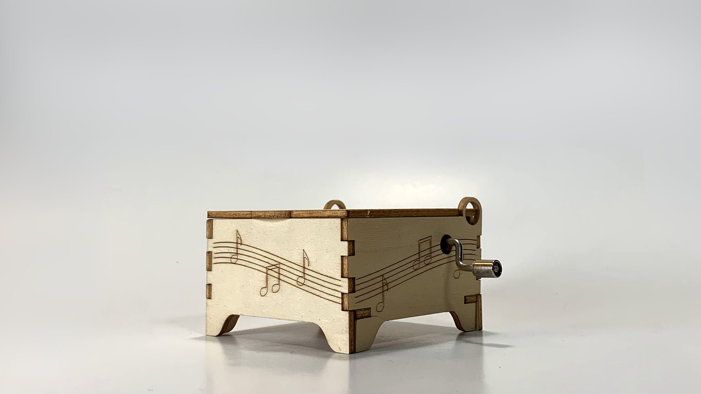 Hand Crank Music Box STEM Kit – Side View Showing Wooden Box with Musical Note Design and Crank Handle