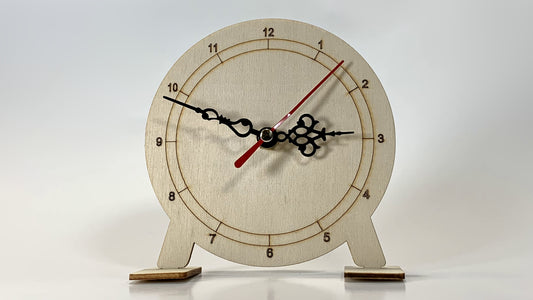 Straight-on view of My Little Clock STEM Kit showing detailed wooden clock face with black hour, minute, and red second hands