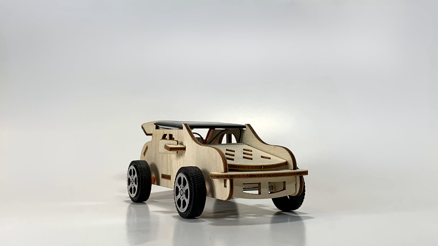 Front angled view of the Solar-Powered Race Car STEM Kit showcasing a wooden car body, aerodynamic design, and mounted solar panel