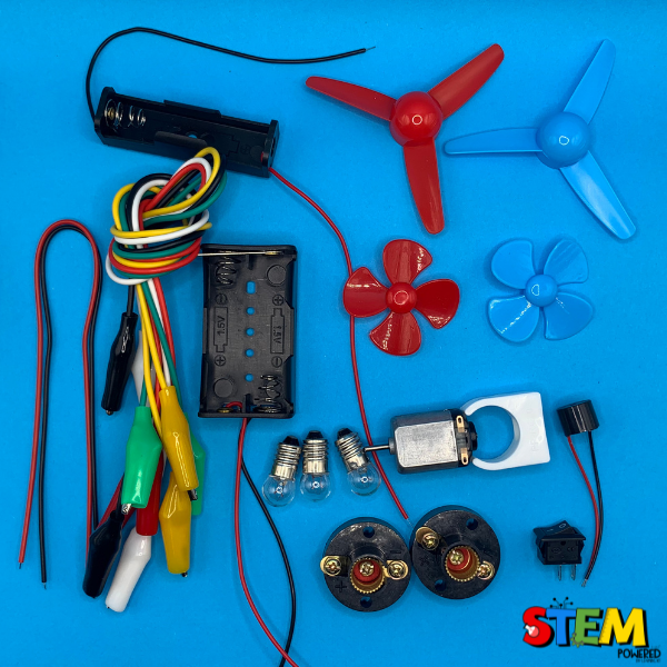 Close-up view of the Electric Circuit Kit accessories, including propellers, wires, switches, and light bulbs, arranged neatly for STEM learning activities.